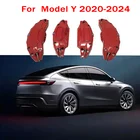 Red aluminium brake caliper covers fitted on Tesla Model Y 2020 to 2024 front and rear wheels