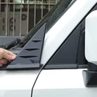 Glossy black ABS rearview mirror triangle spoiler trim installed on white Toyota Land Cruiser 250 Prado LC250, showing aerodynamic side profile enhancement