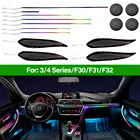 RGB LED ambient lighting kit installed in BMW F30 F31 F32 F34 interior showing 256-colour symphony strip lighting across dashboard, door panels and footwell with multicolour gradient display