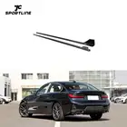 JC Sportline dry pre-preg carbon fiber side skirts for BMW 3 Series G20 G28 LCI 2021 2022, high-gloss 3K twill weave finish, 169.6cm length, shown fitted to black BMW 320i sedan 4-door, adhesive and screw installation, OEM part number ML-ZDH372