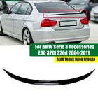 BMW E90 3 Series glossy black TPU rear trunk lip spoiler on a 2006 - 2011 White BMW 3 series model