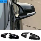 Snap-on M3 M4 style mirror covers for BMW 1 2 3 4 Series in gloss black or carbon fiber.